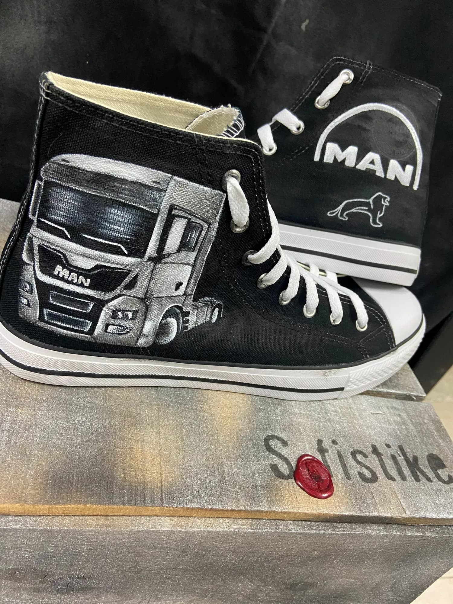 Black high-top hand-painted with a MAN truck