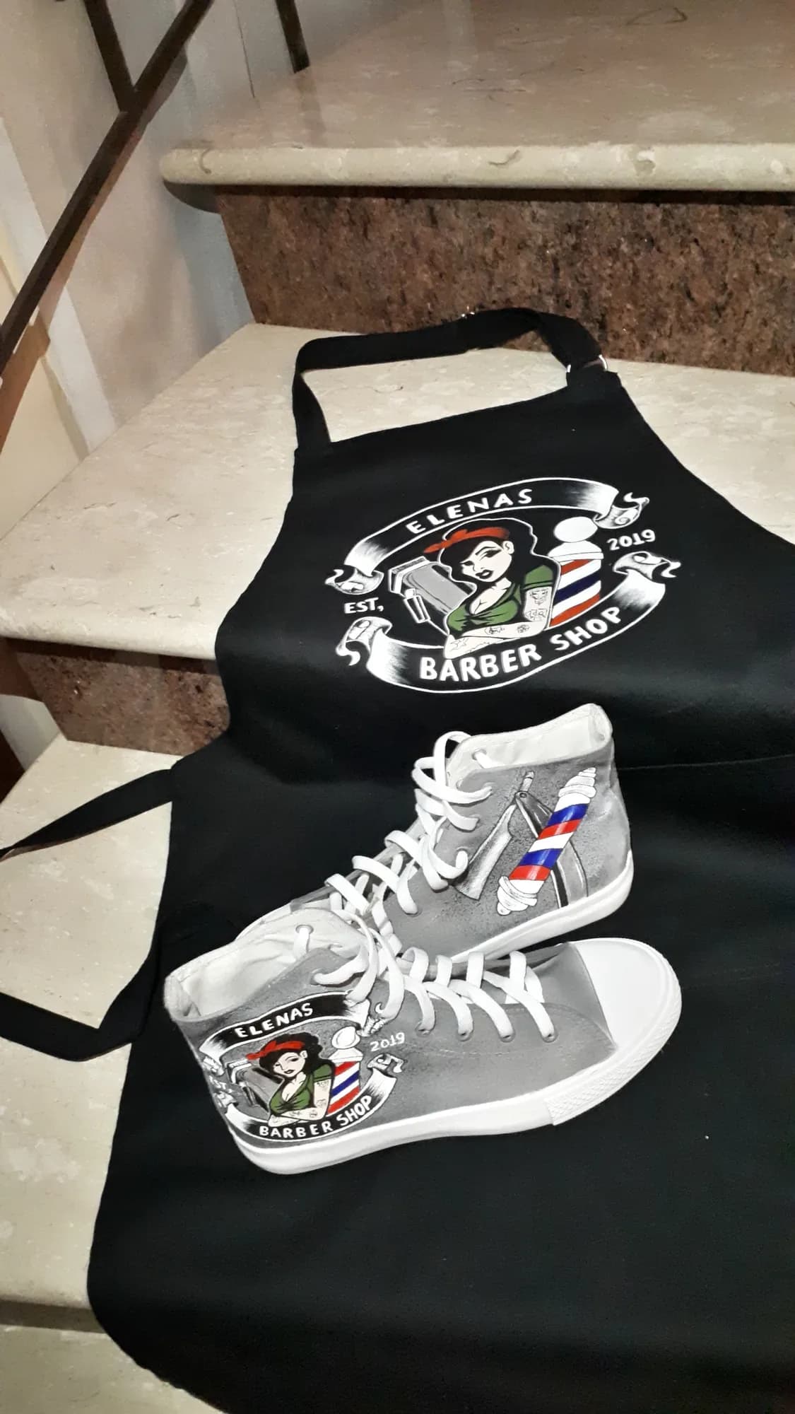 Barber-shop apron and a grey high-top hand-painted with the shop logo