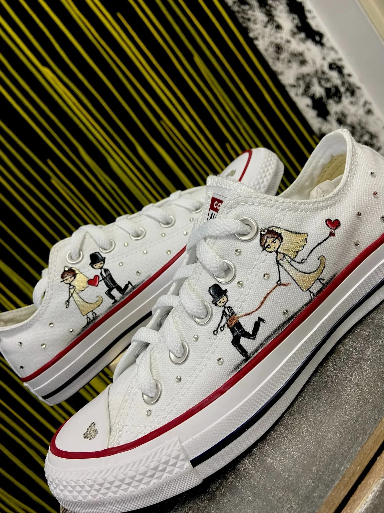 White low-tops hand-painted with a bride and groom