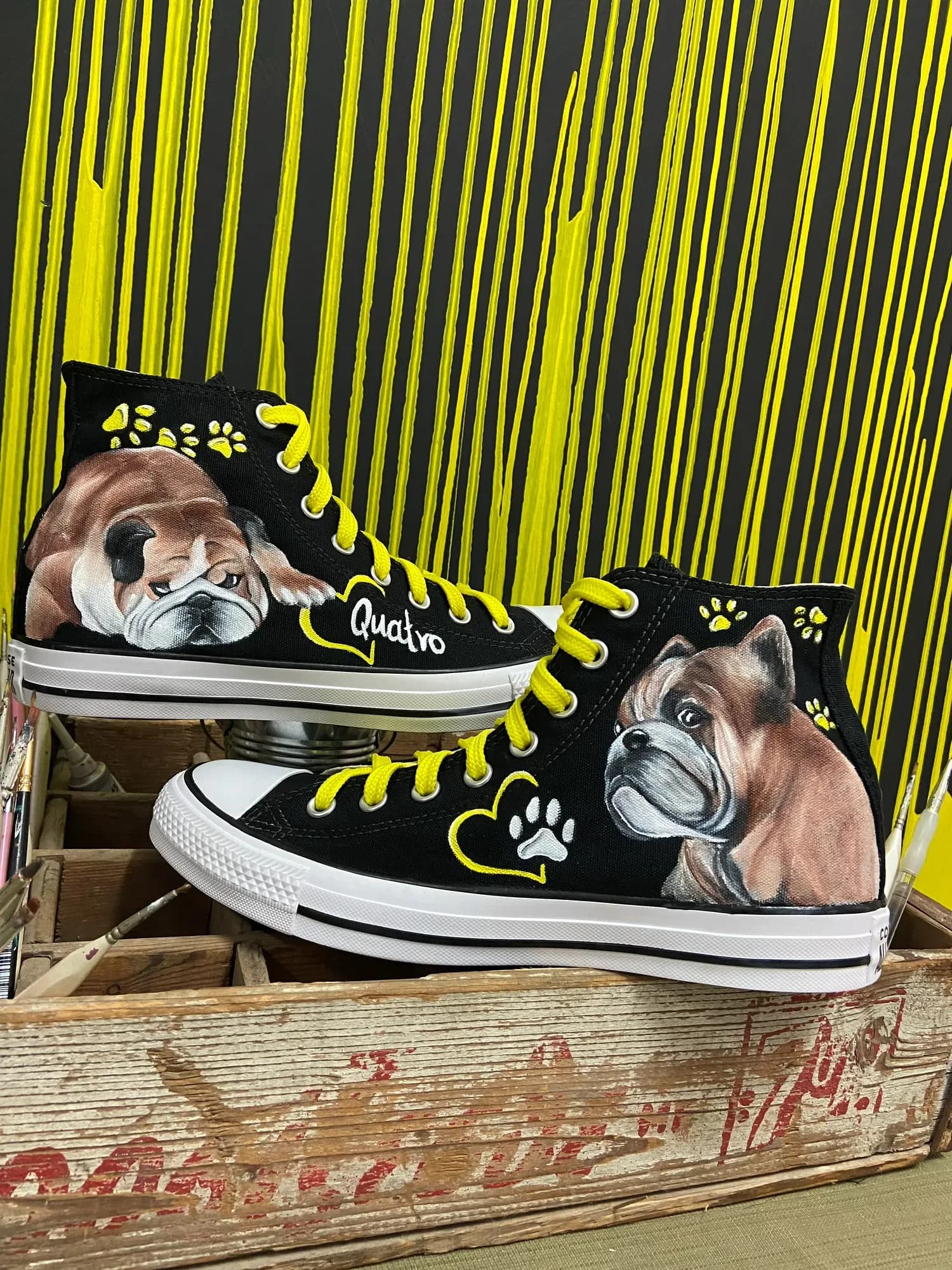 Black high-tops with dog portraits and yellow laces