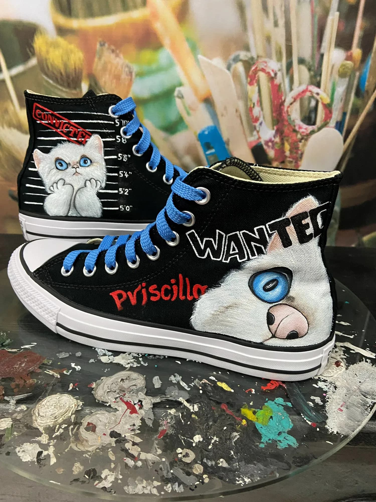 Black high-top hand-painted with a 'Wanted' cat and blue laces
