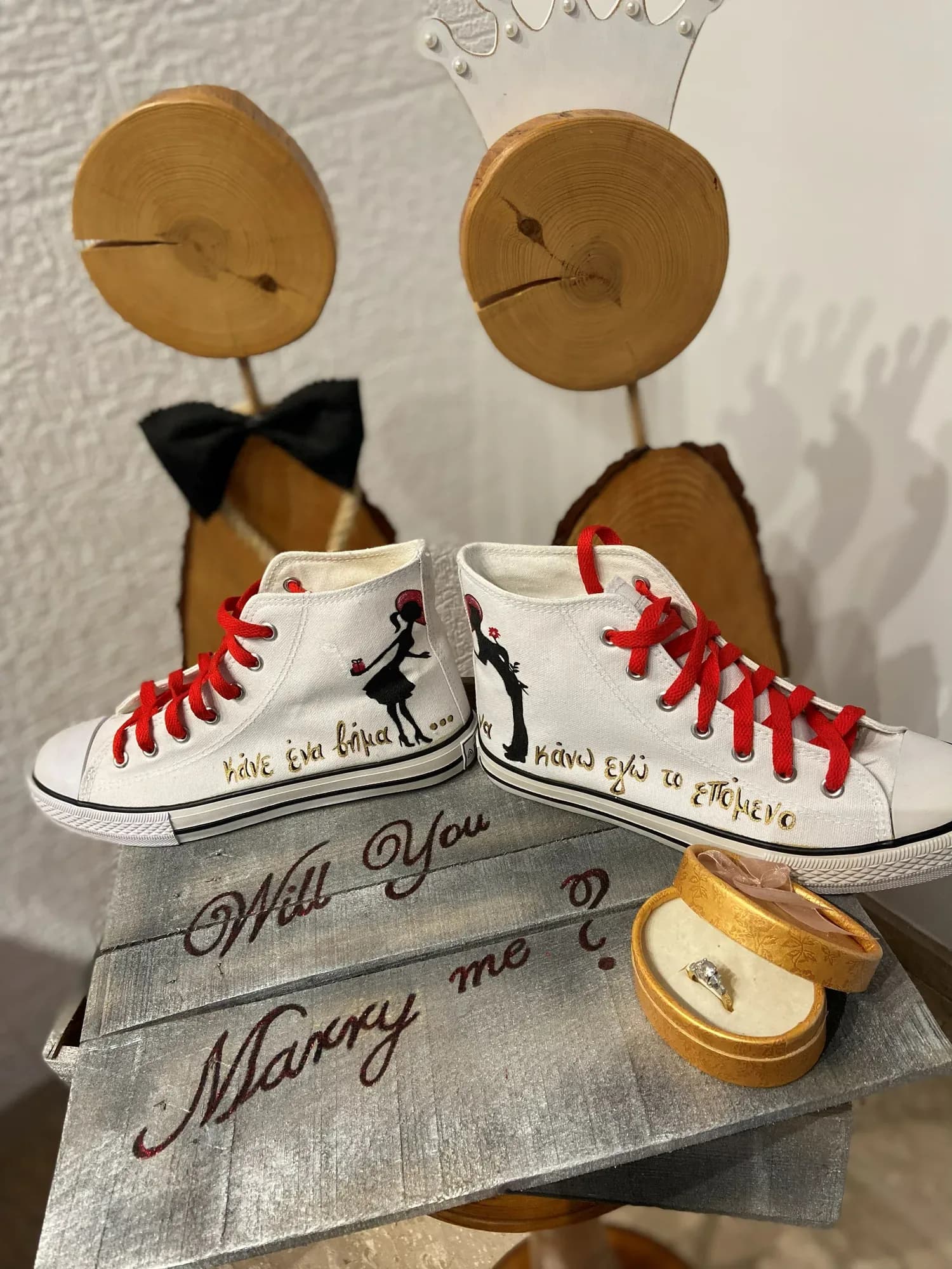 Proposal high-tops with 'Will you marry me' next to a ring box