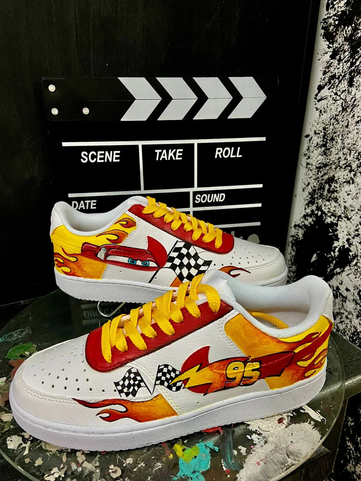 Kids' sneakers hand-painted with flames and a race car