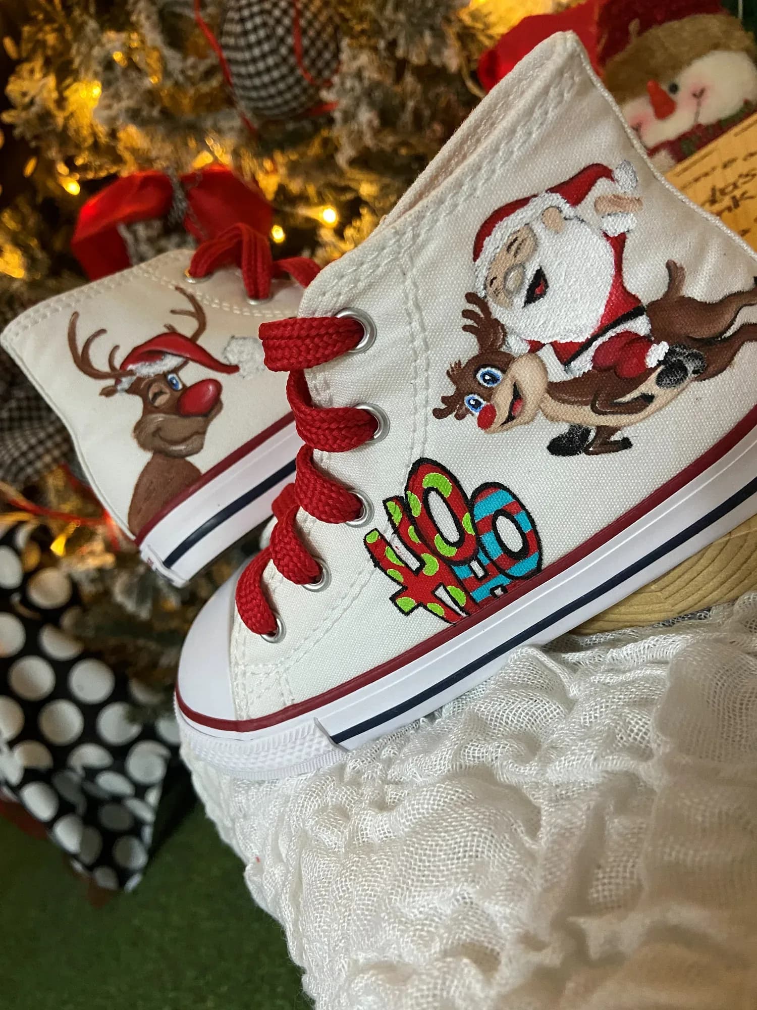 White high-top with Santa, a reindeer and red laces