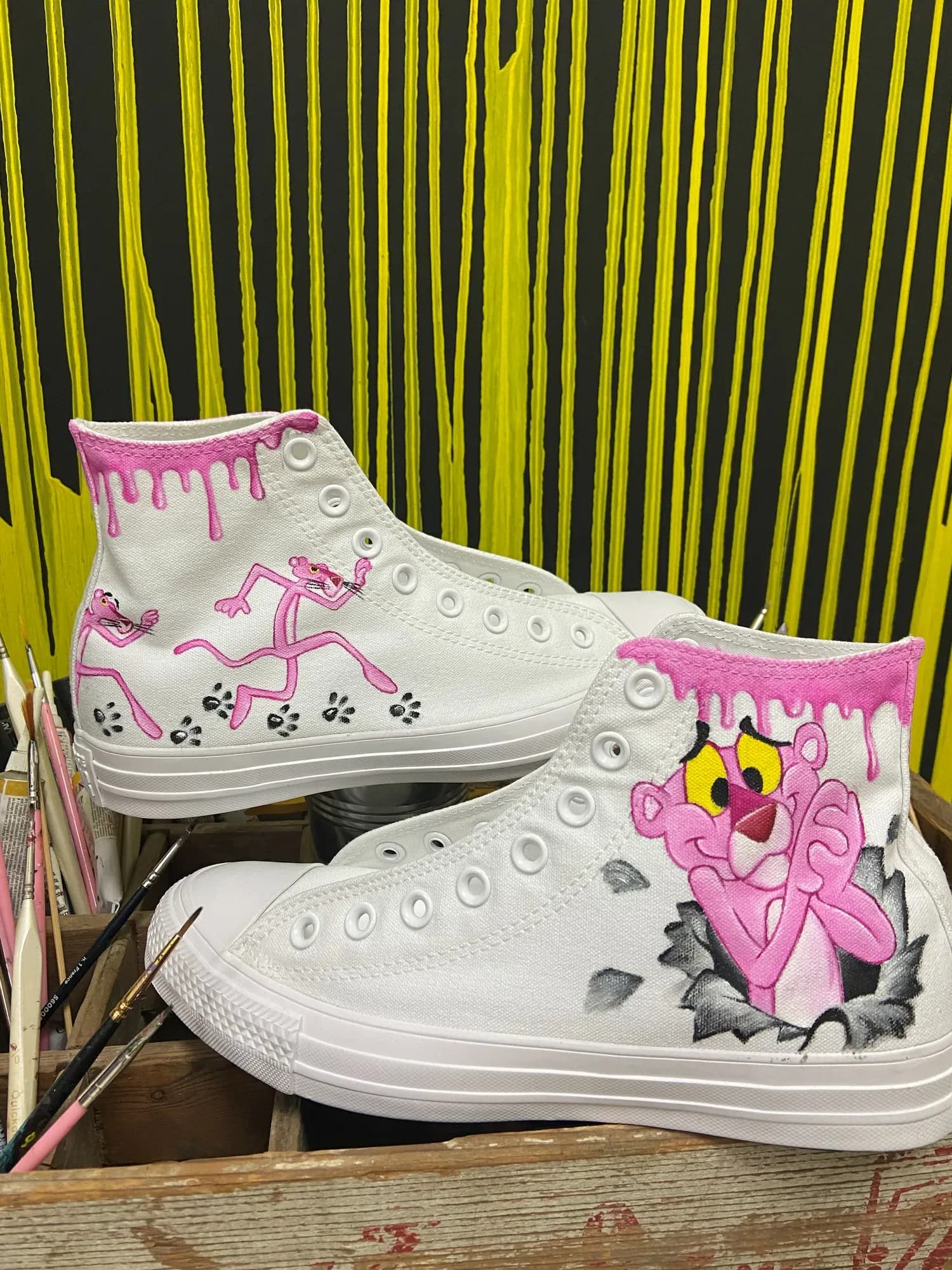 White high-tops hand-painted with the Pink Panther and pink paw prints