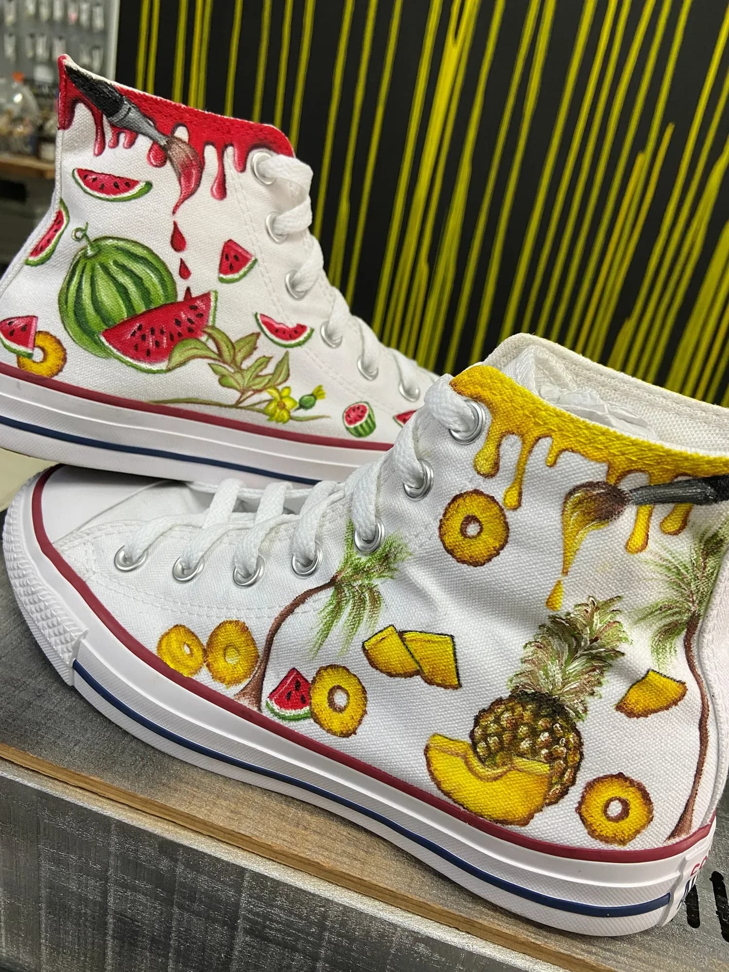 White high-tops hand-painted with summer fruit: watermelon, pineapple and honey