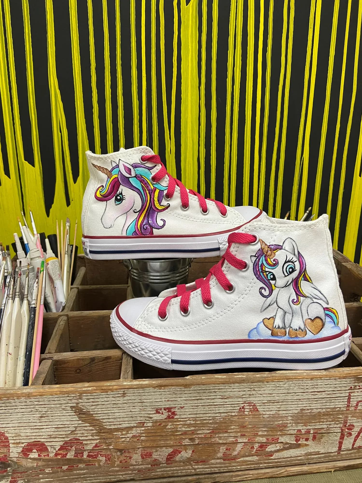 White kids' high-tops with a hand-painted unicorn and pink laces