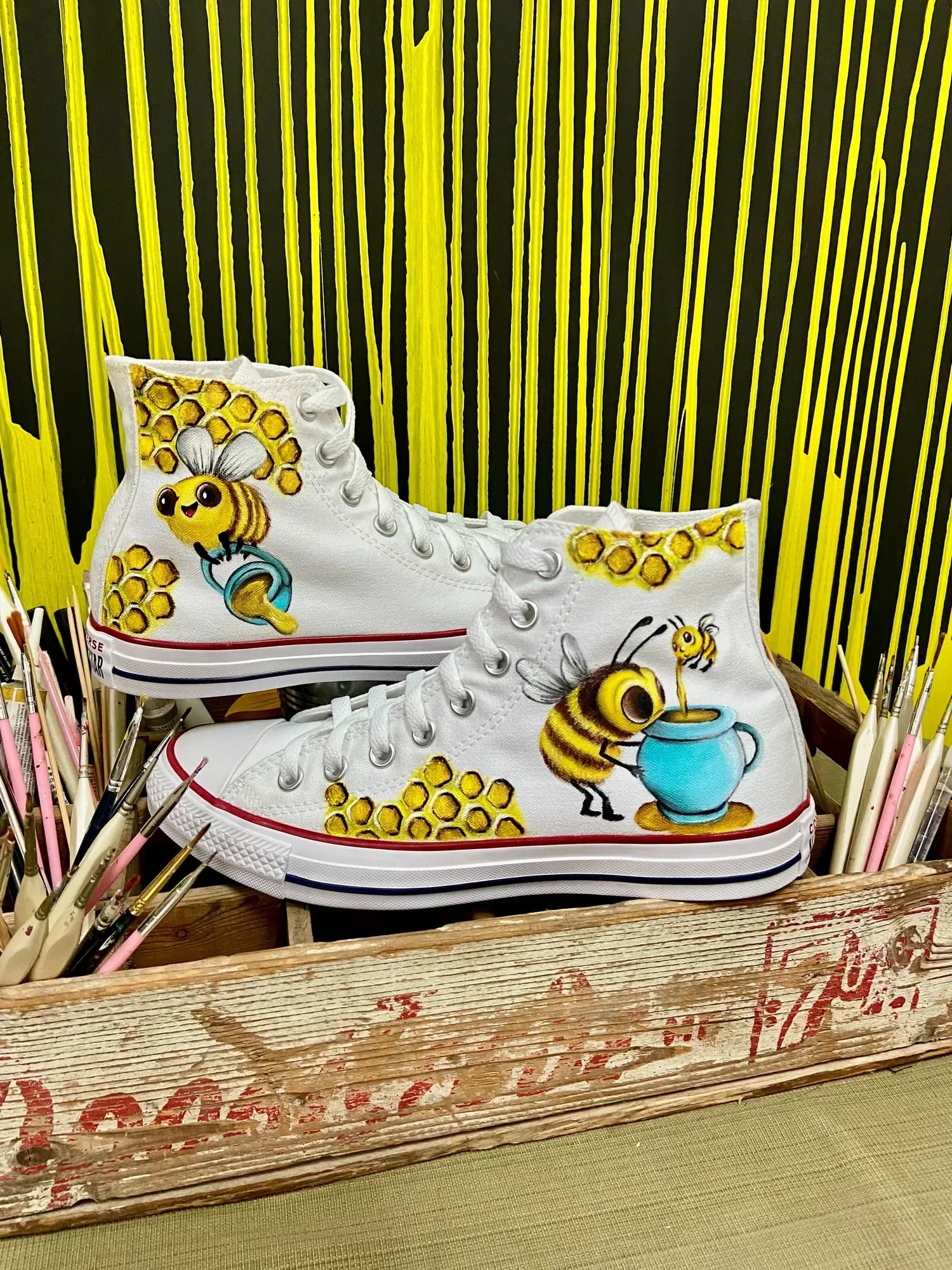 White high-tops hand-painted with bees and honeycomb