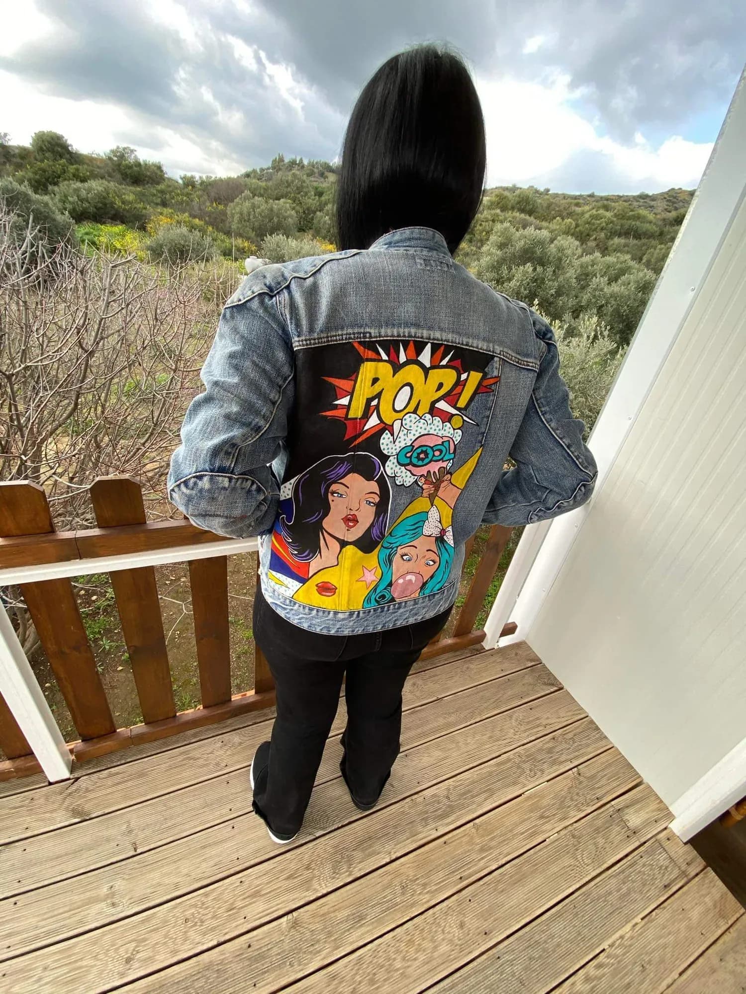 Denim jacket hand-painted with a pop-art girl and the word POP
