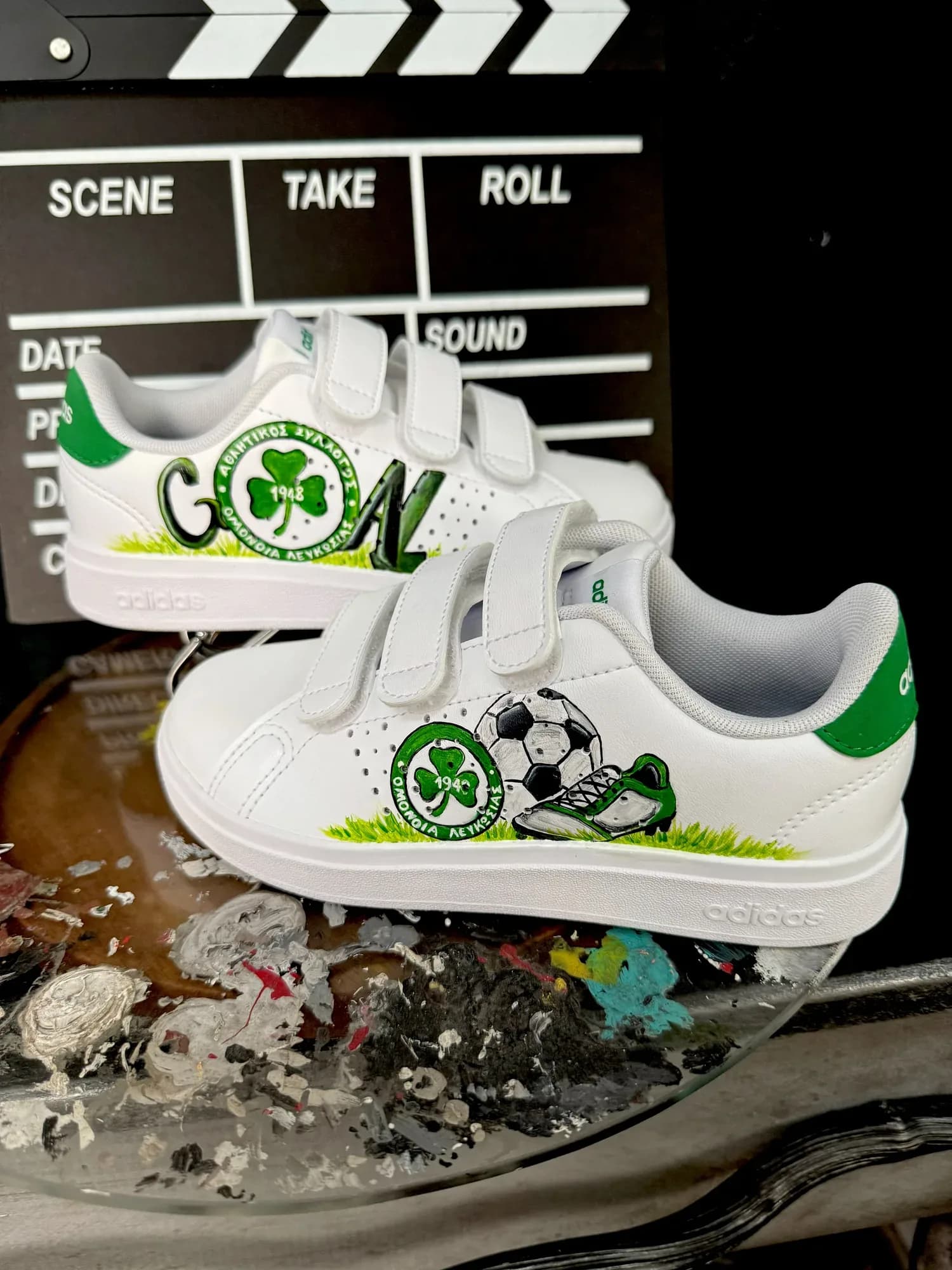 White kids' velcro sneakers hand-painted with the Omonia badge, a football and the word GOAL