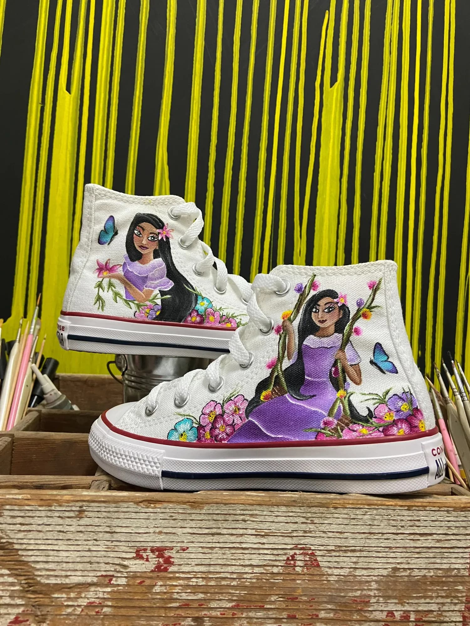 White high-tops hand-painted with Encanto characters and flowers