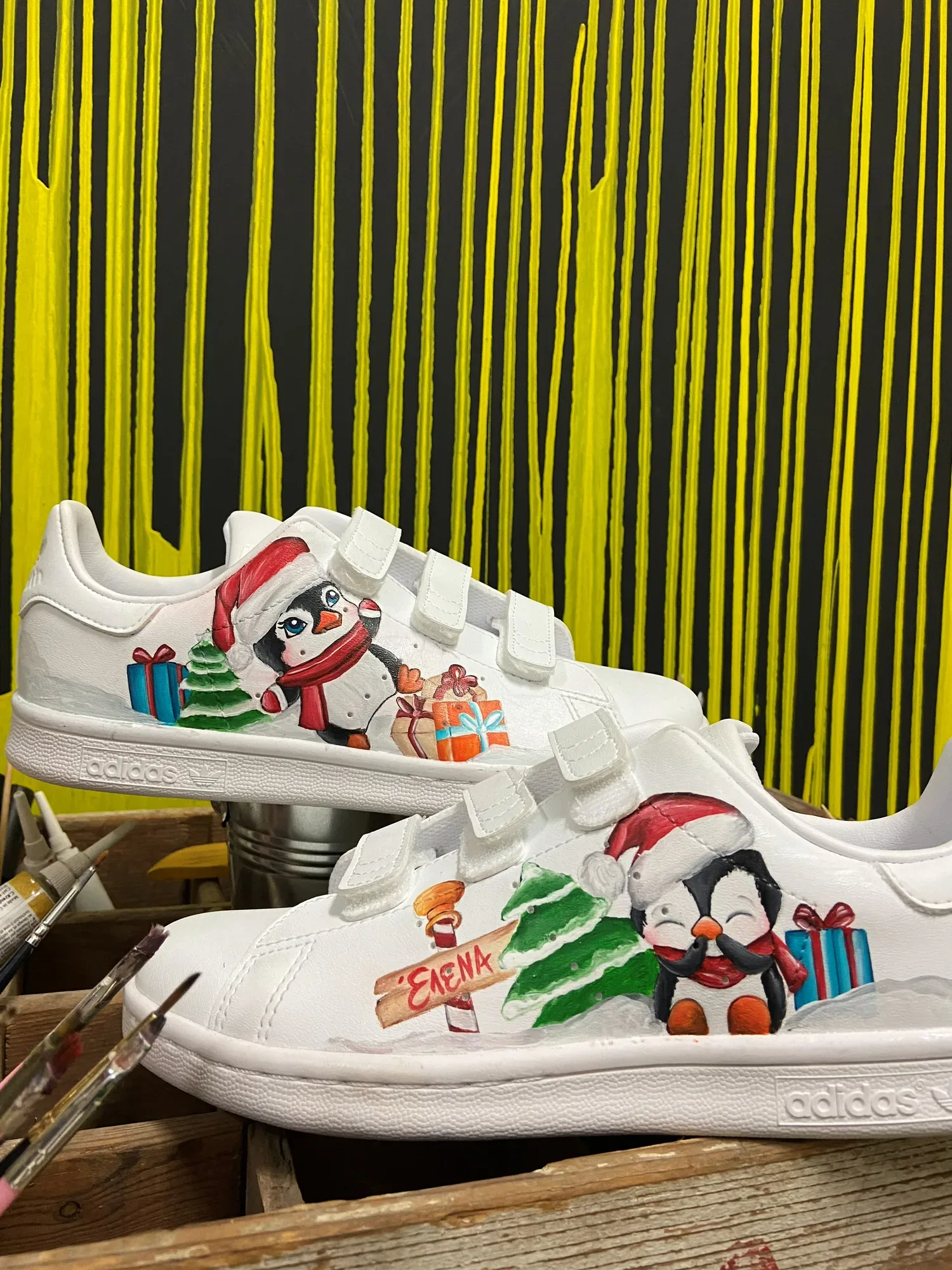 Kids' sneakers hand-painted with penguins and a Christmas tree