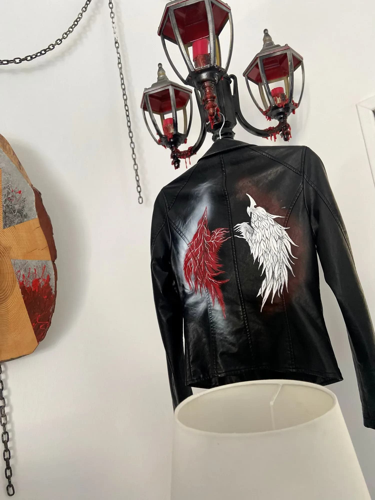 Black leather jacket hand-painted with red and white wings