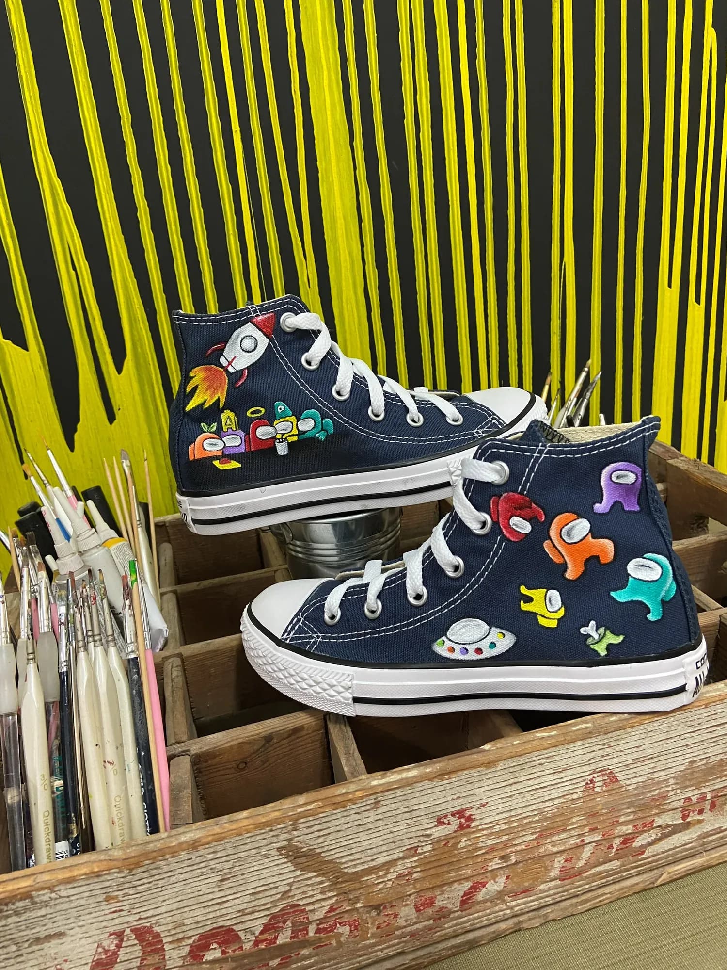 Navy high-tops hand-painted with Among Us crewmates and flying saucers