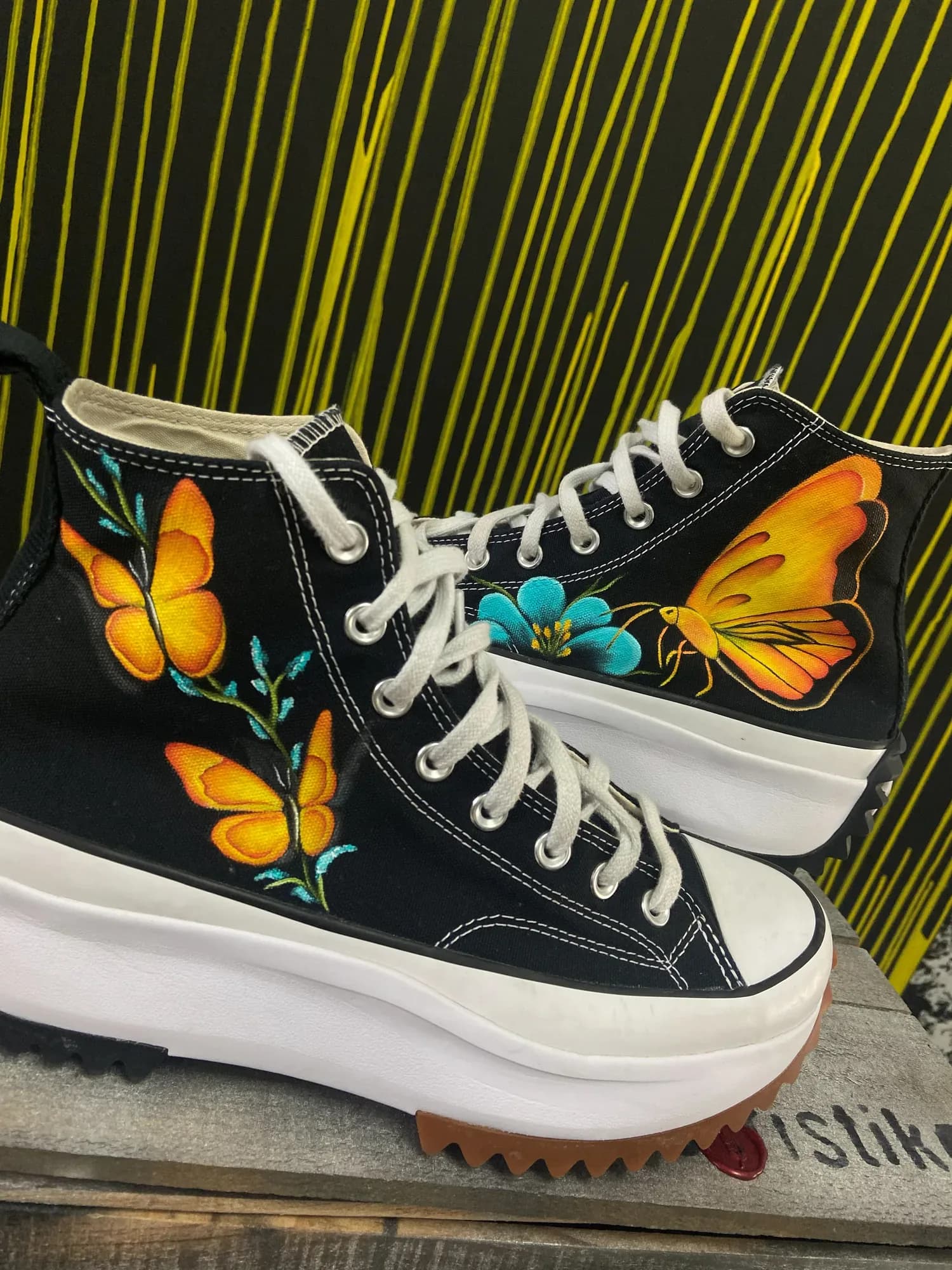 Black platform high-tops hand-painted with butterflies