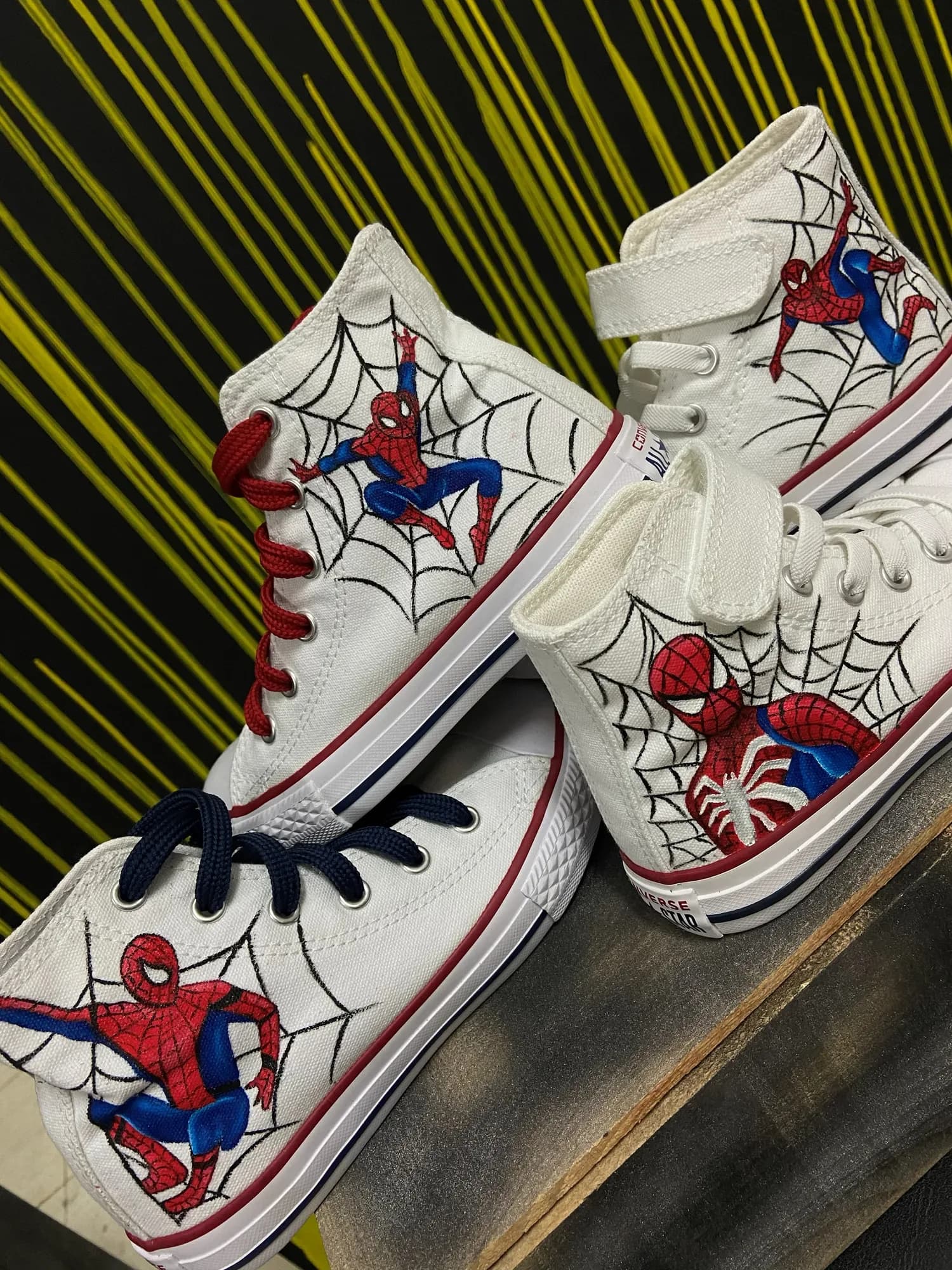 Kids' sneakers hand-painted with Spider-Man and cobwebs